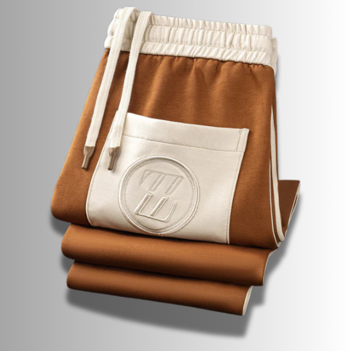 "Ensemble jogging élégant pour hommes, coupe moderne, couleur foncée, tissu respirant, idéal sport et détente."