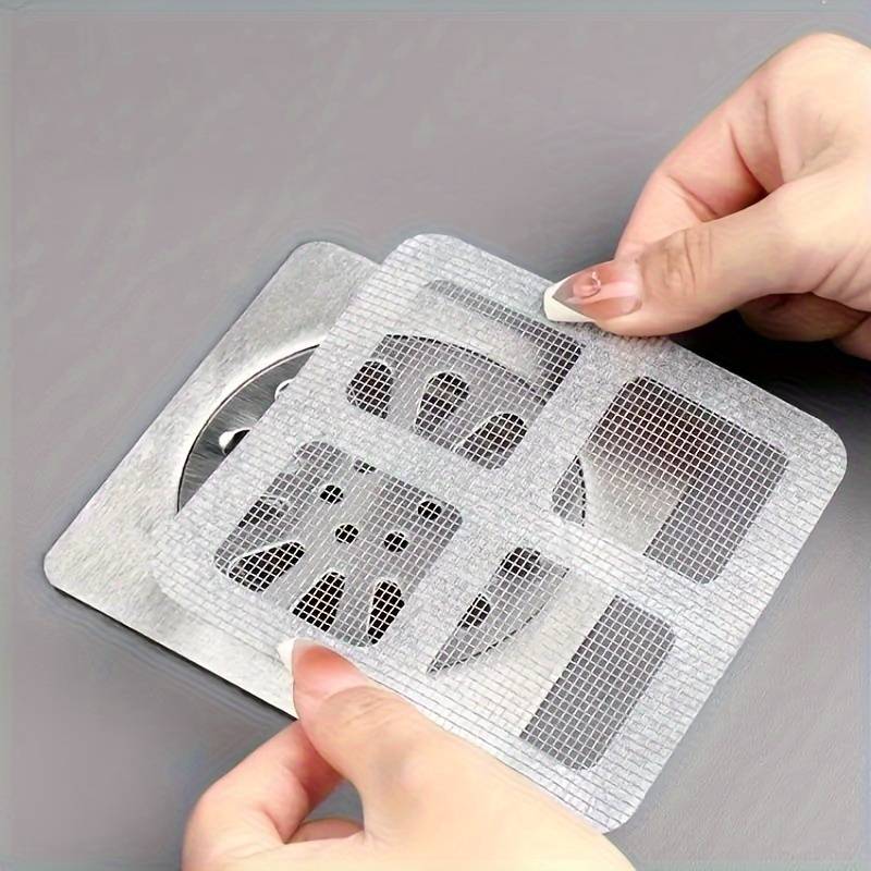 "Filtre de drain jetable transparent pour douche, prévient les blocages, maille biodégradable, facile à installer."