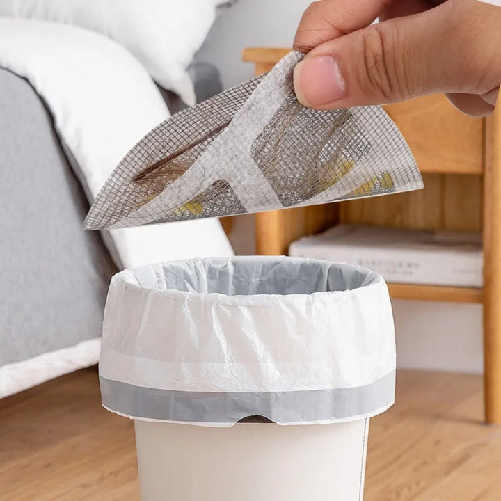 "Filtre de drain jetable transparent pour douche, prévient les blocages, maille biodégradable, facile à installer."