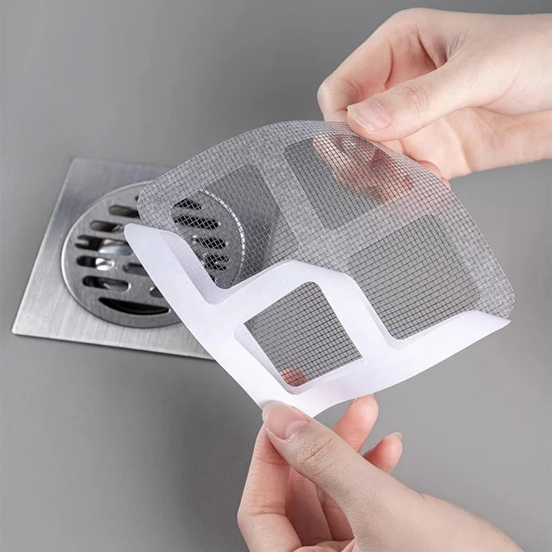 "Filtre de drain jetable transparent pour douche, prévient les blocages, maille biodégradable, facile à installer."