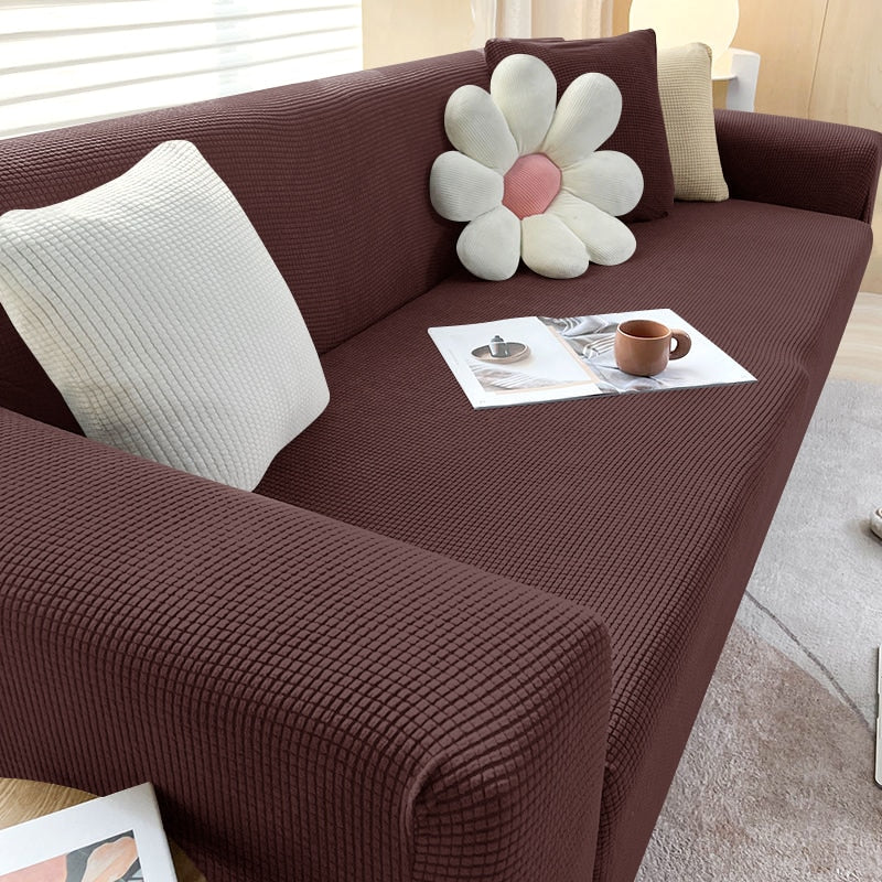 "Housse de canapé élastique beige chic, ajustement impeccable, protège et embellit divers styles de canapés."