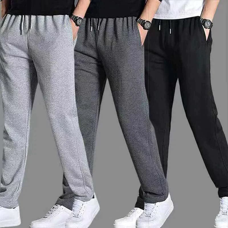 "Joggers noirs pour homme, style urbain et décontracté, avec coupe fuselée et poches zippées pratiques."