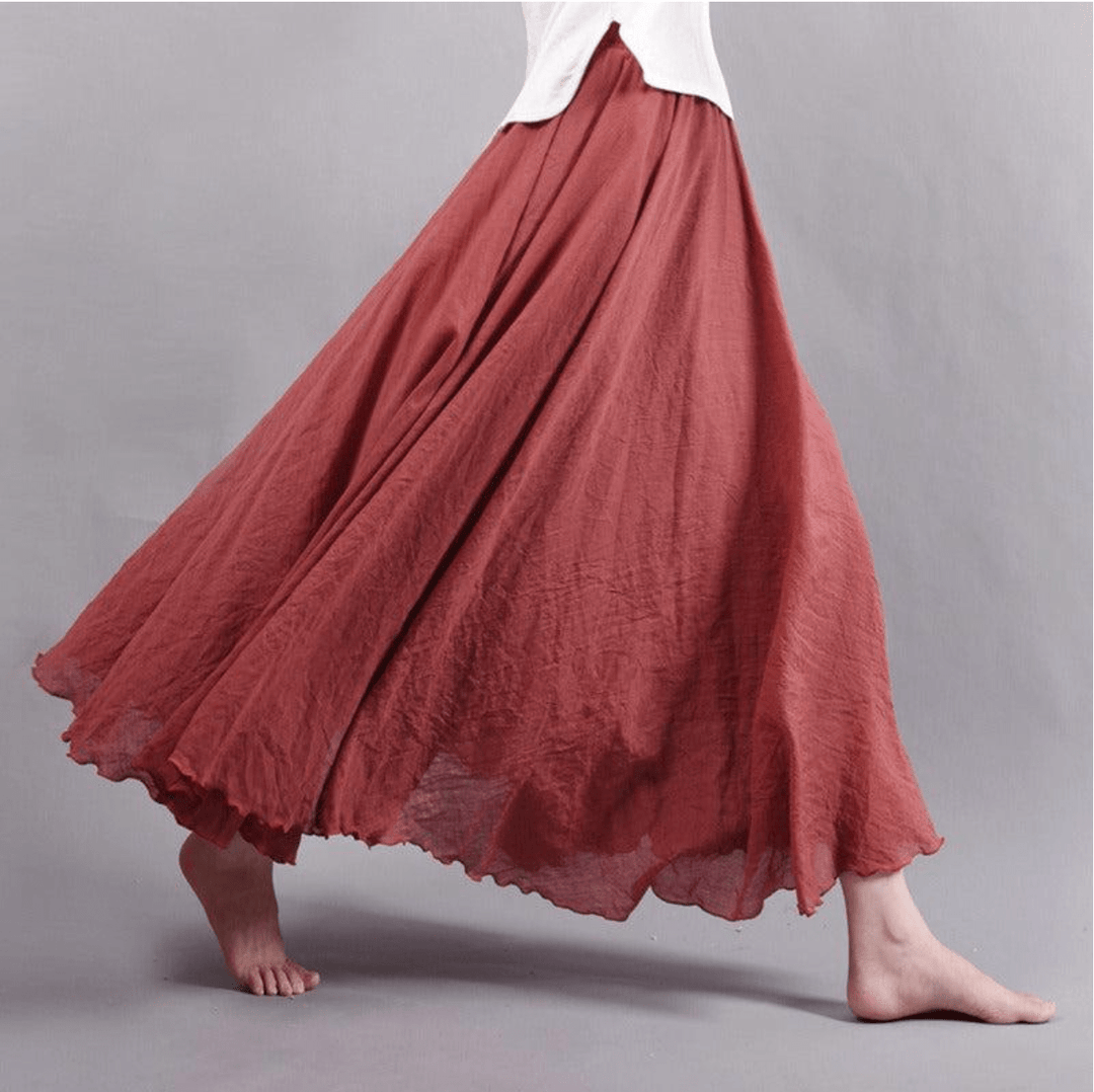 "Jupe longue bohème en lin beige, coupe fluide, taille élastique, parfaite pour un style estival élégant et confortable."
