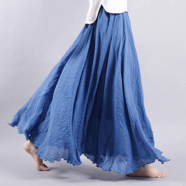 "Jupe longue bohème en lin beige, coupe fluide, taille élastique, parfaite pour un style estival élégant et confortable."