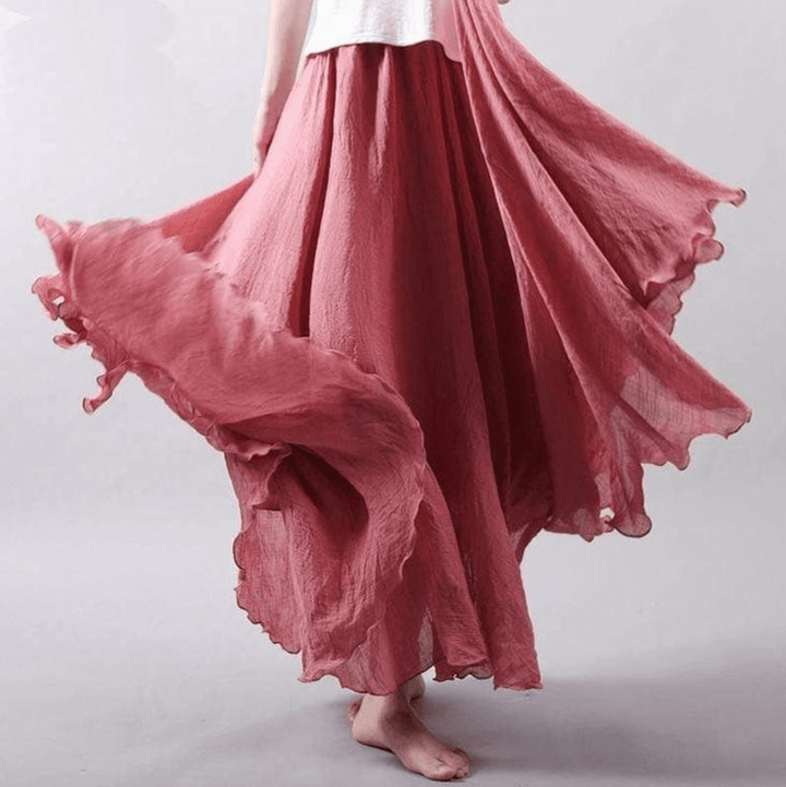"Jupe longue bohème en lin beige, coupe fluide, taille élastique, parfaite pour un style estival élégant et confortable."