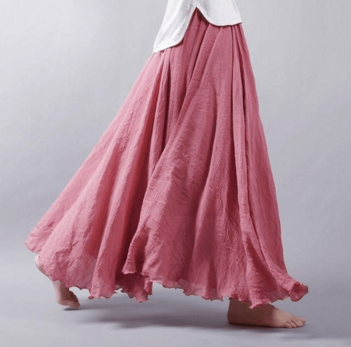 "Jupe longue bohème en lin beige, coupe fluide, taille élastique, parfaite pour un style estival élégant et confortable."
