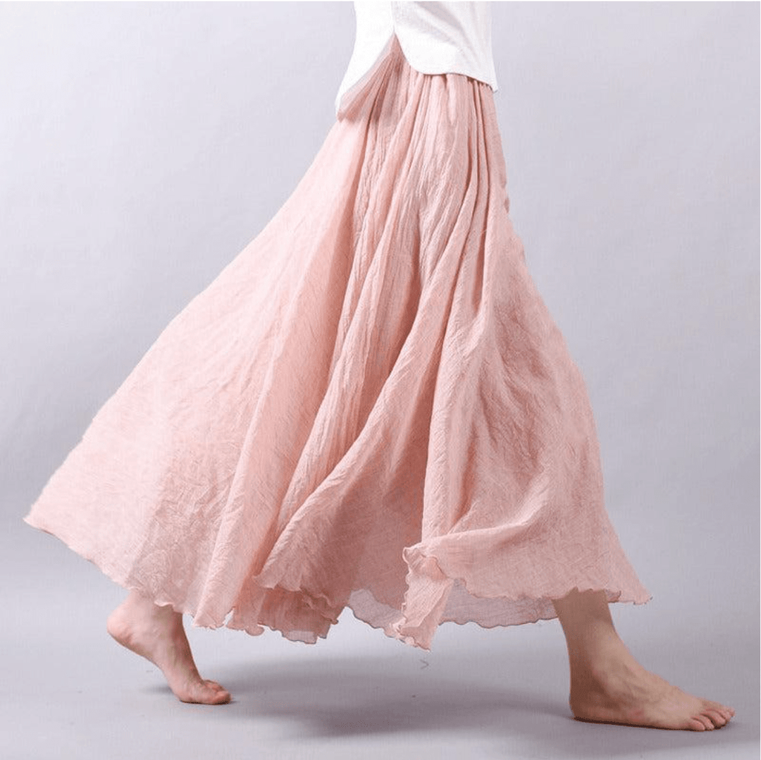 "Jupe longue bohème en lin beige, coupe fluide, taille élastique, parfaite pour un style estival élégant et confortable."