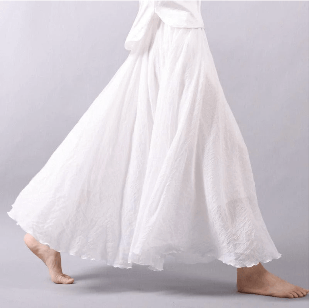 "Jupe longue bohème en lin beige, coupe fluide, taille élastique, parfaite pour un style estival élégant et confortable."