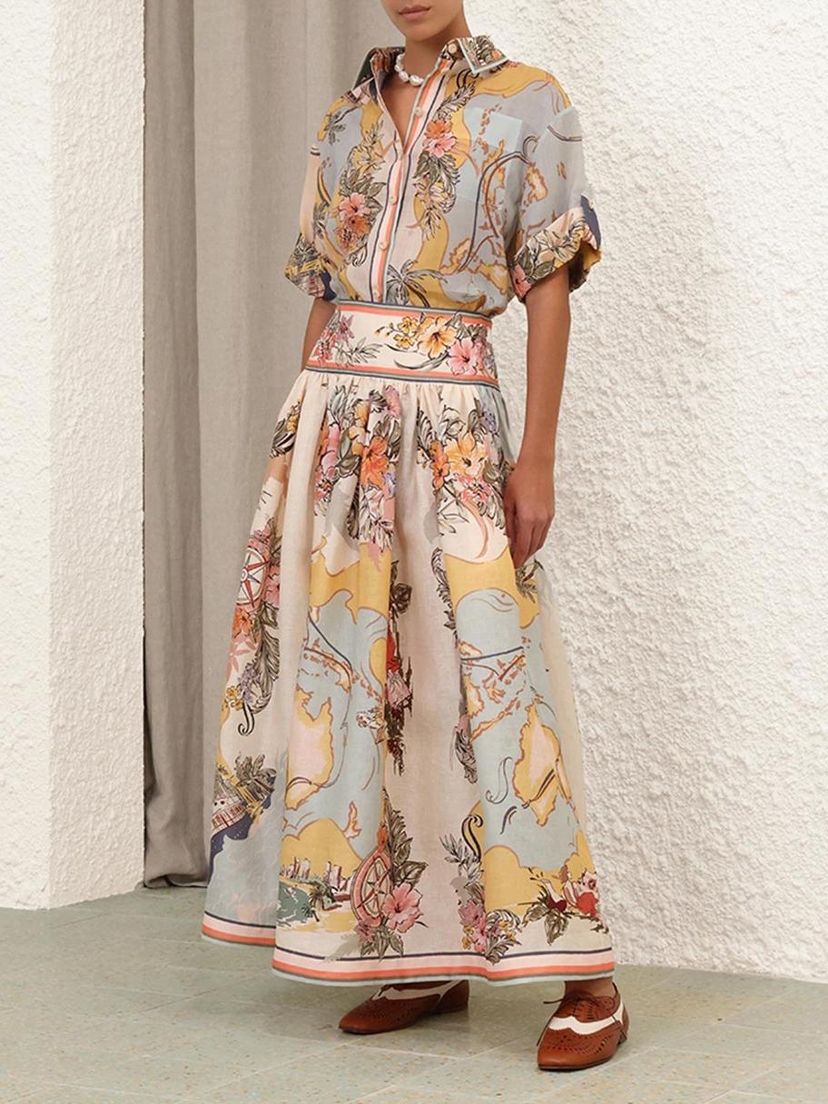 "Jupe midi élégante taille haute avec motifs floraux doux, parfaite pour un look bohème et féminin en toute saison."