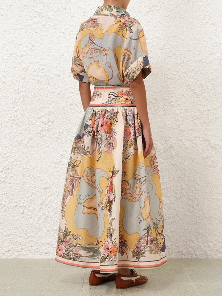 "Jupe midi élégante taille haute avec motifs floraux doux, parfaite pour un look bohème et féminin en toute saison."