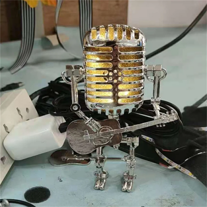 "Lampe de table robotique avec guitare, design original et artistique, ambiance chaleureuse pour décoration intérieure"