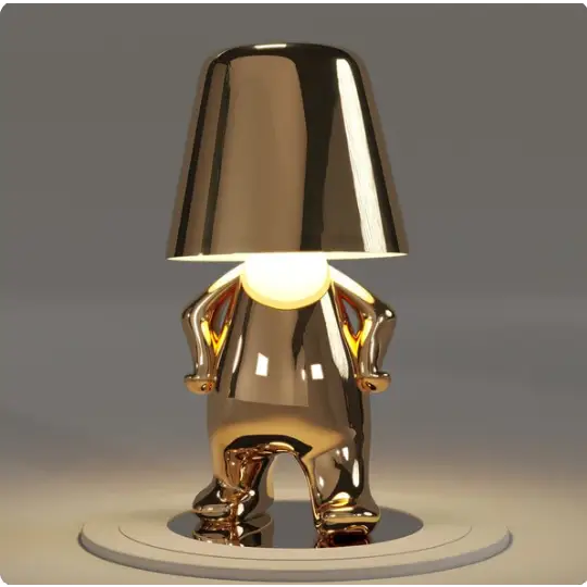 Lampe LED sans fil en or, design sculptural, lumière douce, parfaite pour créer une ambiance chaleureuse et moderne.