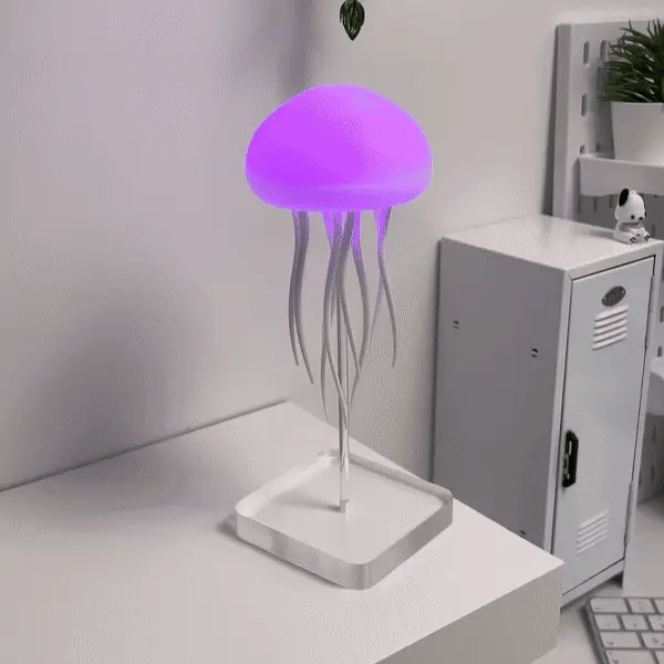 "Lampe méduse LED hypnotique avec couleurs changeantes, simulation mouvement fluide, ambiance relaxante, lumineuse."