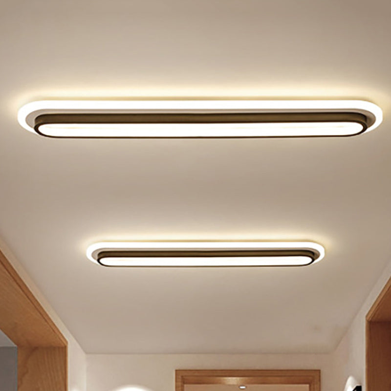 Lampe plafond ovale LED noir et blanc moderne, design épuré, diffuseur acrylique, élégance contemporaine pour intérieur.