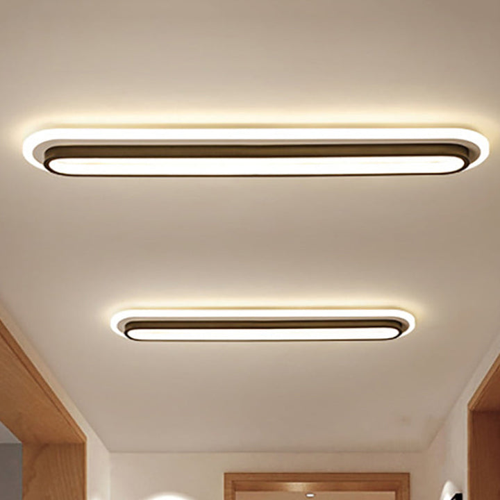 Lampe plafond ovale LED noir et blanc moderne, design épuré, diffuseur acrylique, élégance contemporaine pour intérieur.