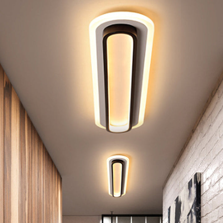 Lampe plafond ovale LED noir et blanc moderne, design épuré, diffuseur acrylique, élégance contemporaine pour intérieur.