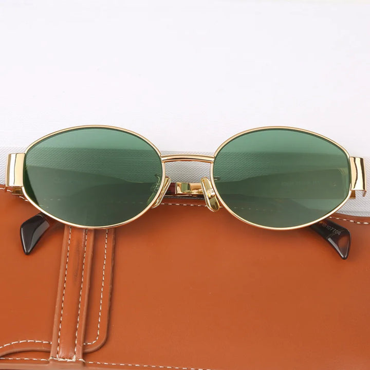 "Lunettes de soleil ovales unisexes avec monture métallique chic et lentilles anti-UV pour protection et style ensoleillé."