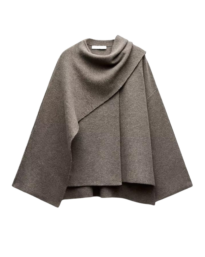 "Manteau cape femme chic automne, design asymétrique gris, tissu doux, style moderne et confortable pour temps frais."