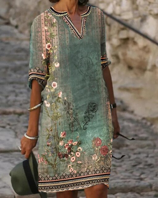 Mini-robe évasée rétro, imprimé floral captivant, manches demi-longues, idéale pour l'été, élégance féminine.