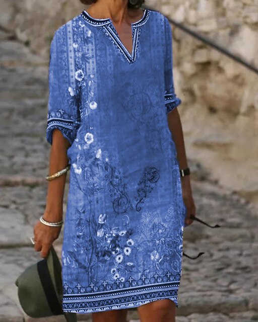 Mini-robe évasée rétro, imprimé floral captivant, manches demi-longues, idéale pour l'été, élégance féminine.