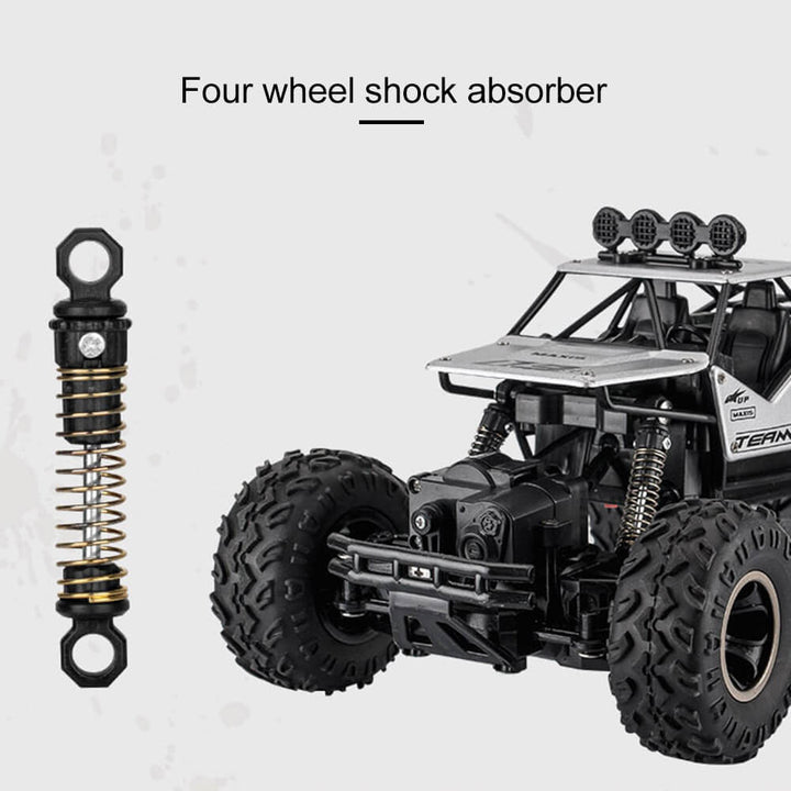 "Monster Truck RC 4x4 rouge sur terrain rocailleux, suspension robuste et pneus antidérapants pour aventures extrêmes."