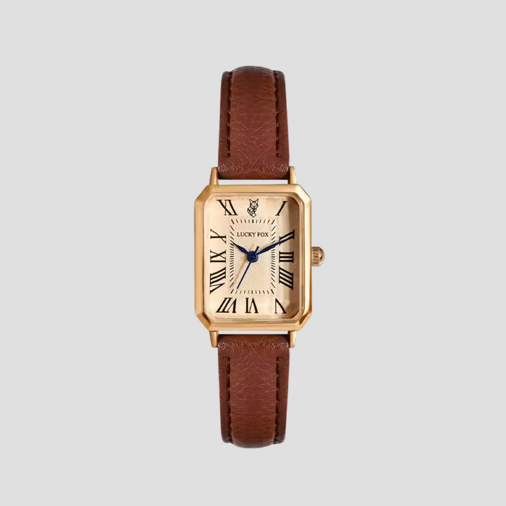 Montre carrée élégante avec boîtier doré et bracelet cuir texturé pour style classique et sophistication féminine.
