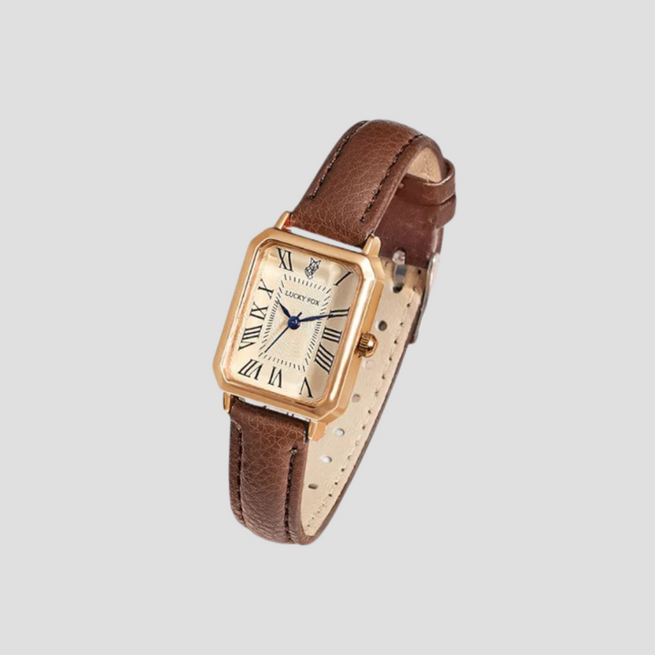 Montre carrée élégante avec boîtier doré et bracelet cuir texturé pour style classique et sophistication féminine.