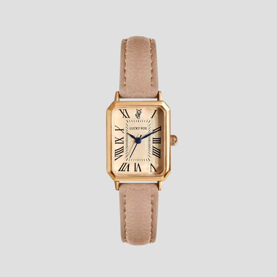 Montre carrée élégante avec boîtier doré et bracelet cuir texturé pour style classique et sophistication féminine.