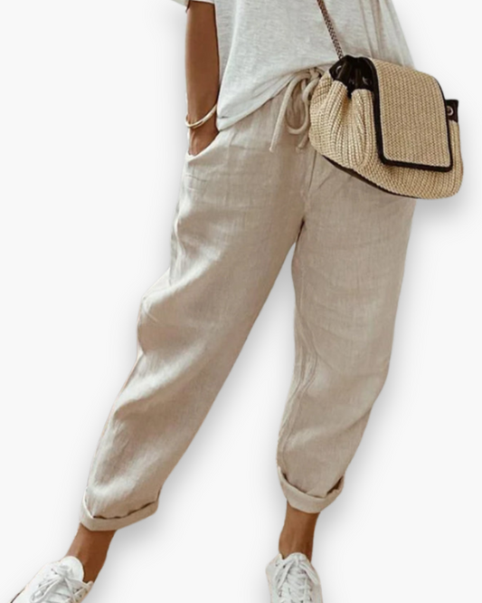 "Pantalon ample femme, tissu léger, style moderne, poches discrètes, taille élastique, coupe élégante, confort optimal"
