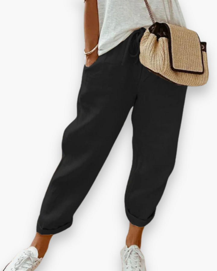 "Pantalon ample femme, tissu léger, style moderne, poches discrètes, taille élastique, coupe élégante, confort optimal"