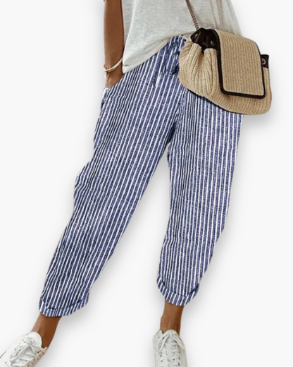 "Pantalon ample femme, tissu léger, style moderne, poches discrètes, taille élastique, coupe élégante, confort optimal"
