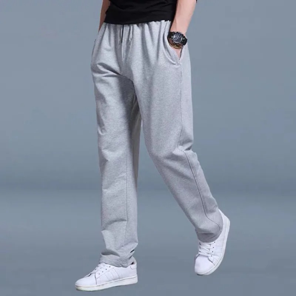 "Pantalon de jogging homme décontracté, coupe droite, couleur unie, taille élastique, tissu doux et léger."