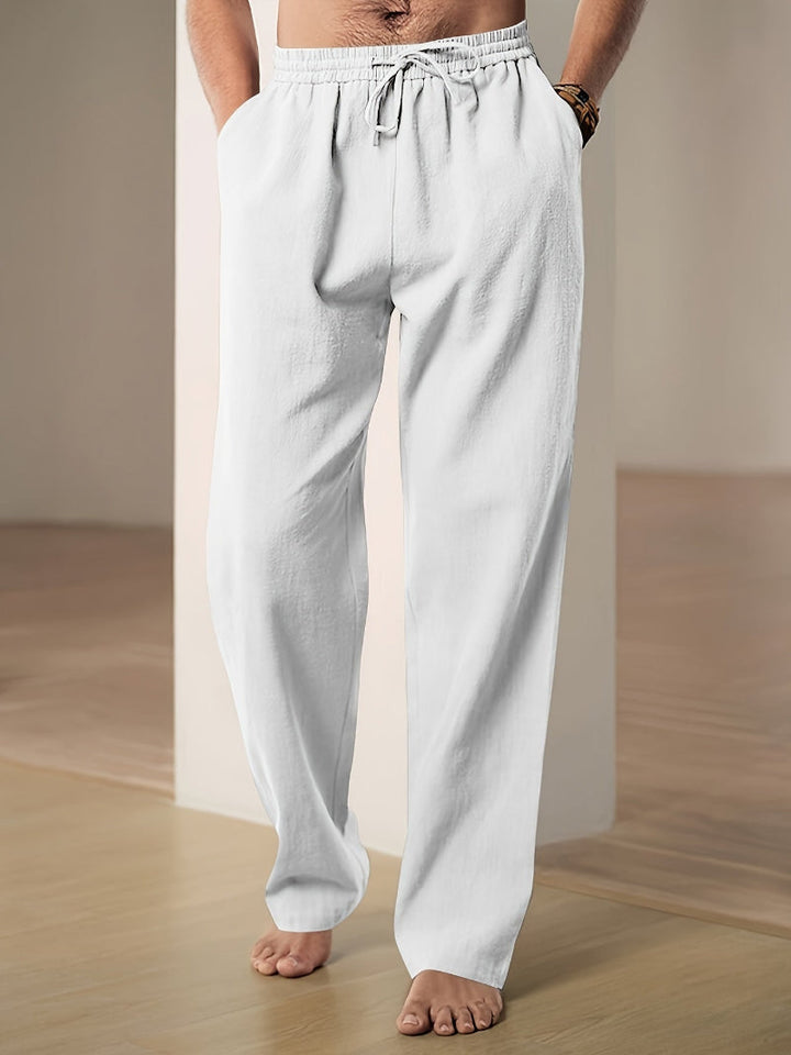 "Pantalon décontracté homme ample, beige avec cordon de serrage et poches, vue de côté, style et confort optimal"