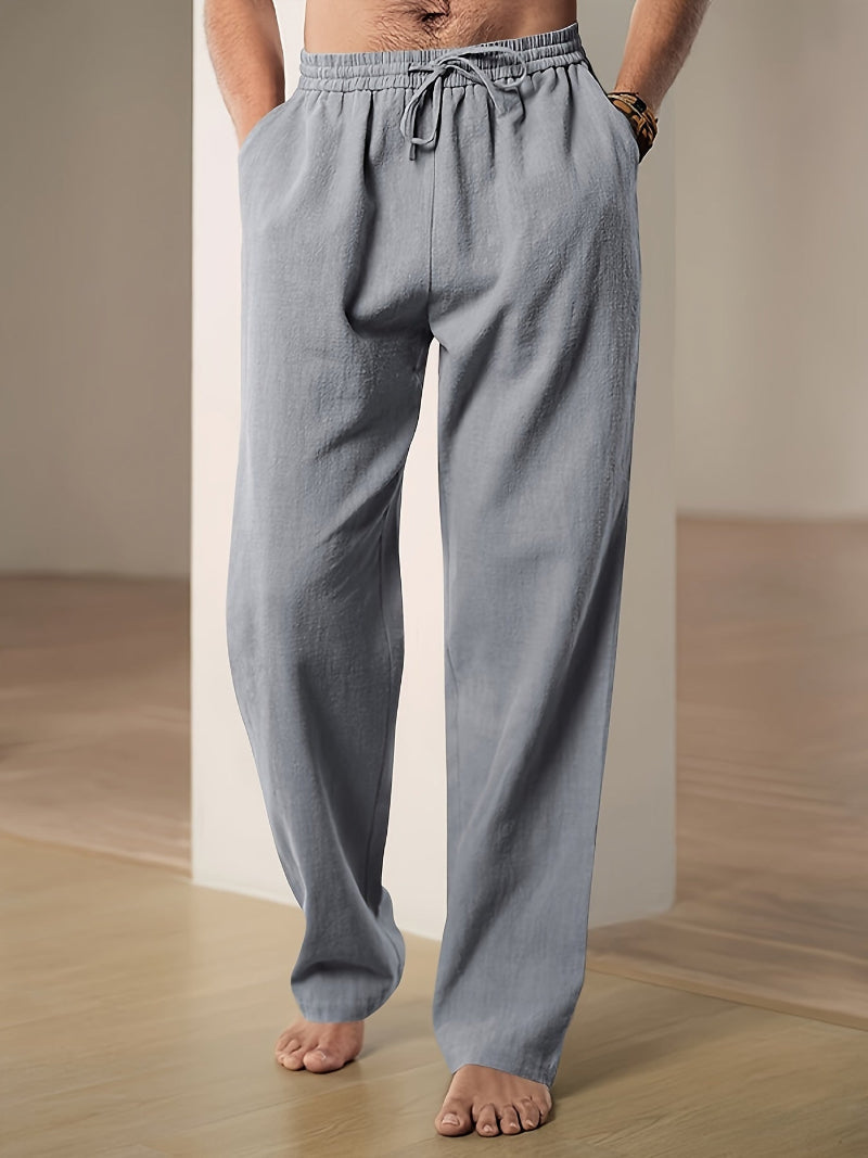 "Pantalon décontracté homme ample, beige avec cordon de serrage et poches, vue de côté, style et confort optimal"