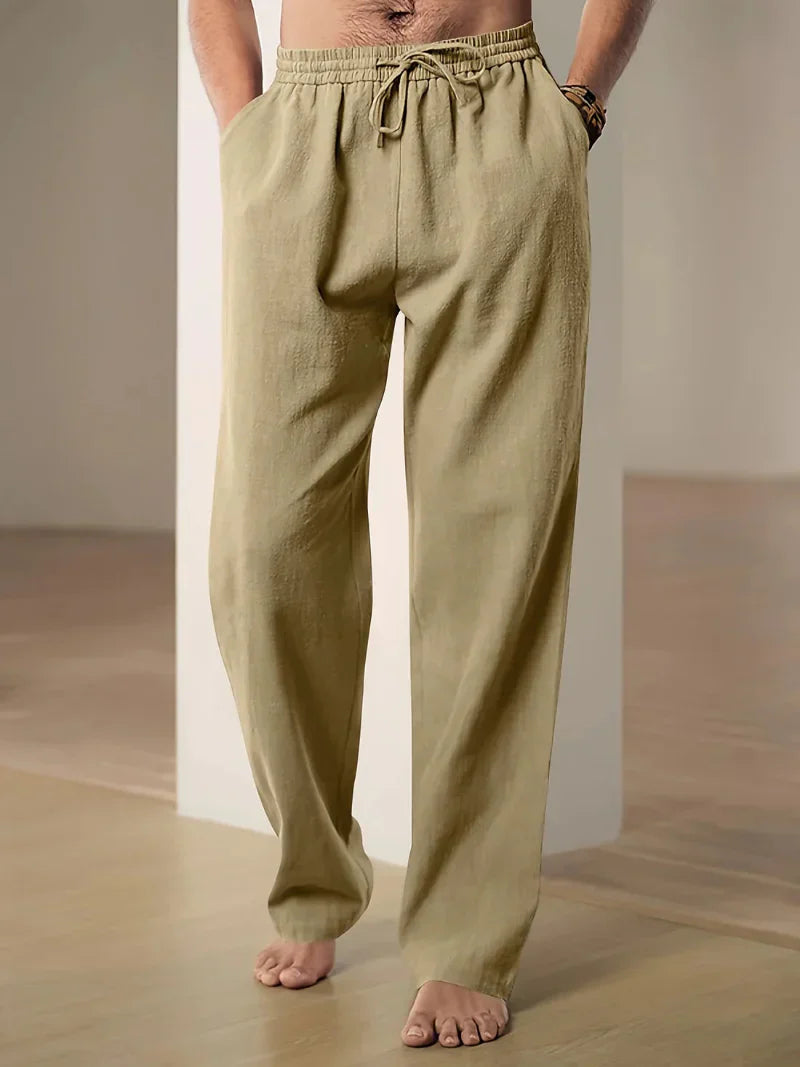 "Pantalon décontracté homme ample, beige avec cordon de serrage et poches, vue de côté, style et confort optimal"