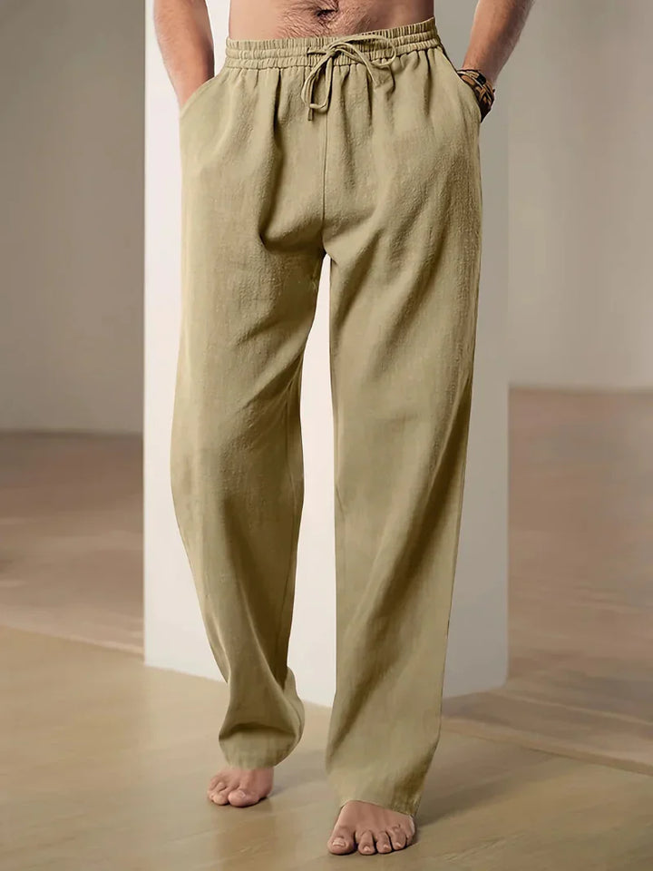 "Pantalon décontracté homme ample, beige avec cordon de serrage et poches, vue de côté, style et confort optimal"