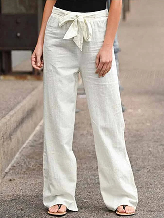 "Pantalon d'été femme en lin, taille haute, coupe ample, léger et respirant pour élégance estivale."