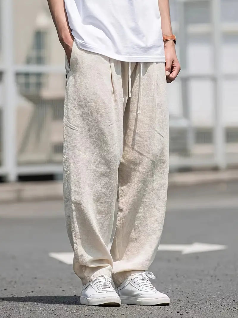 "pantalon en lin ample homme, léger, respirant, design moderne pour confort estival, style décontracté chic"