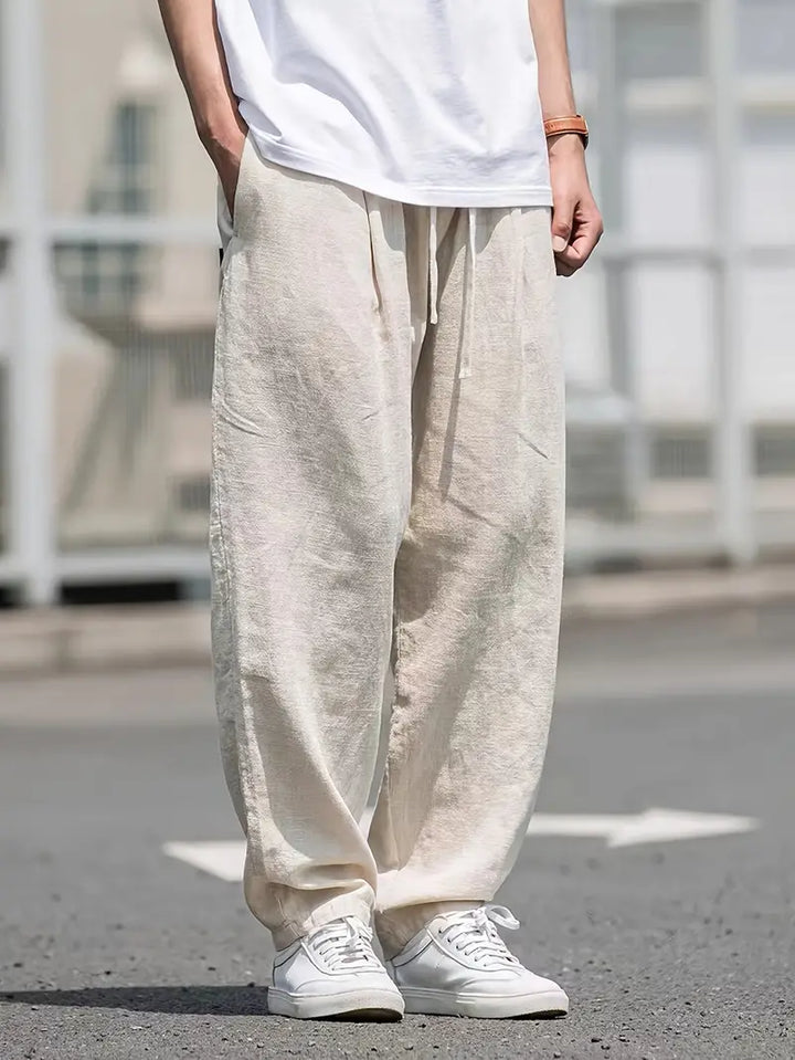 "pantalon en lin ample homme, léger, respirant, design moderne pour confort estival, style décontracté chic"