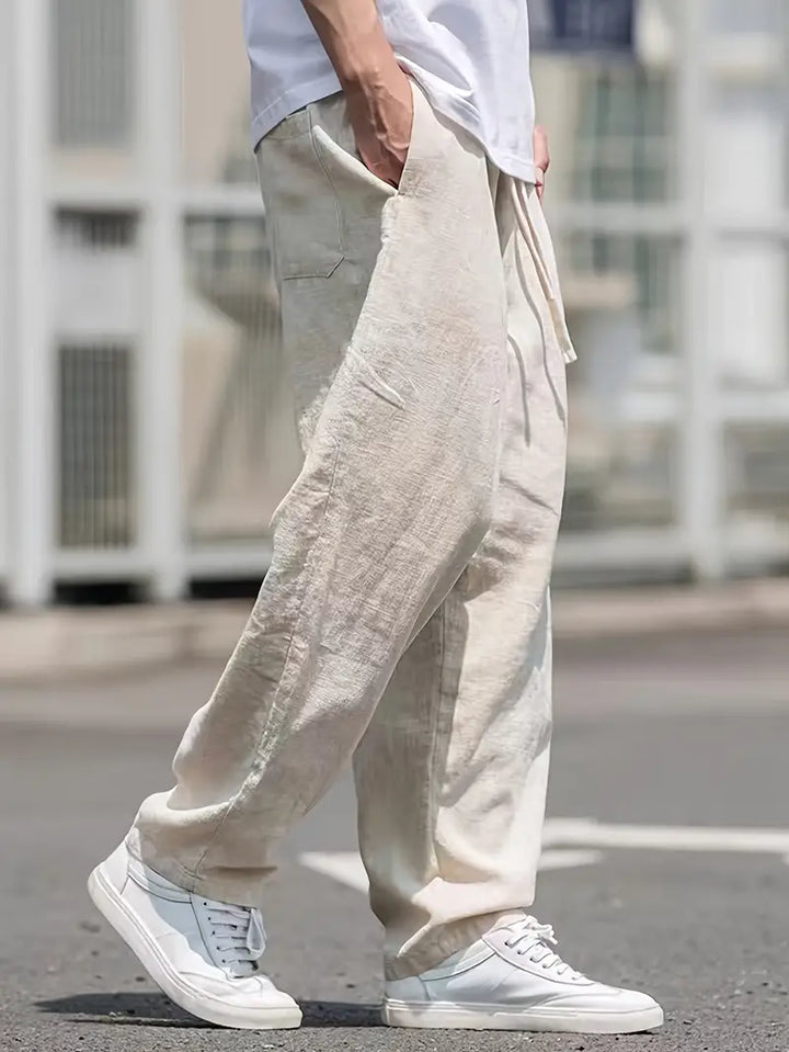 "pantalon en lin ample homme, léger, respirant, design moderne pour confort estival, style décontracté chic"
