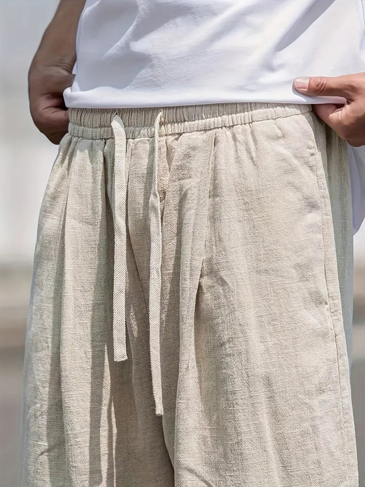 "pantalon en lin ample homme, léger, respirant, design moderne pour confort estival, style décontracté chic"