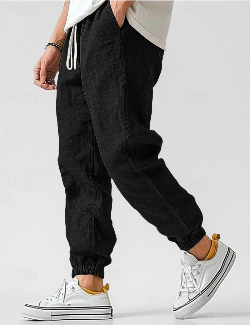 "Pantalon en lin bleu pour hommes, léger et respirant, style décontracté pour l'été, offrant confort et élégance."