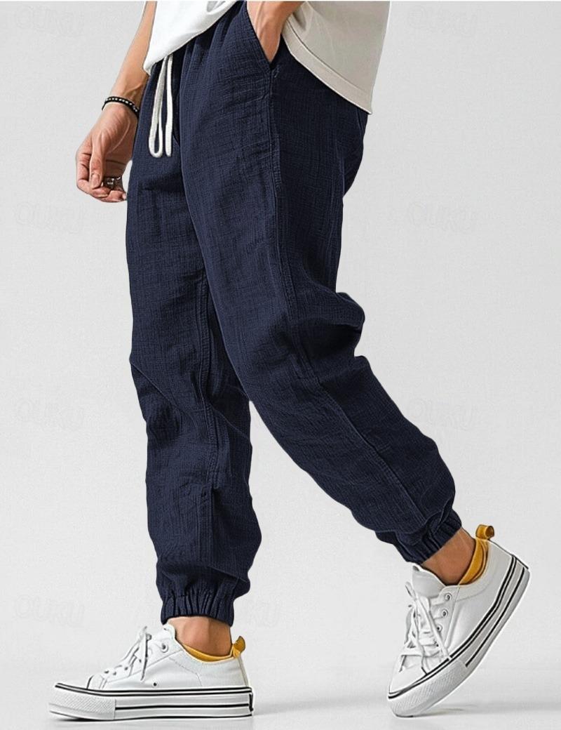 "Pantalon en lin bleu pour hommes, léger et respirant, style décontracté pour l'été, offrant confort et élégance."