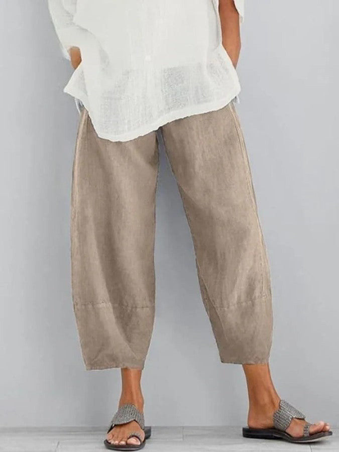 Pantalon en lin femme, coupe ample, couleur ivoire, léger et respirant, idéal pour un style décontracté et estival.