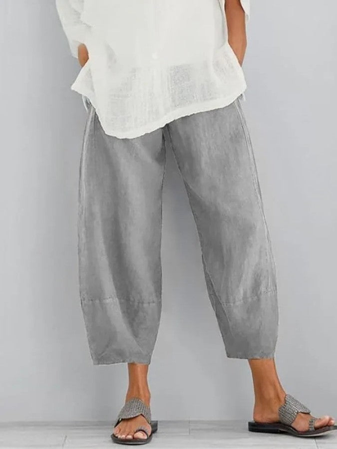 Pantalon en lin femme, coupe ample, couleur ivoire, léger et respirant, idéal pour un style décontracté et estival.