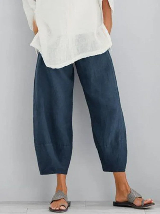 Pantalon en lin femme, coupe ample, couleur ivoire, léger et respirant, idéal pour un style décontracté et estival.