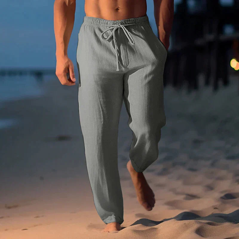 Pantalon en lin homme léger, moderne, gris, coupe décontractée, parfait pour l'été, tissu respirant, style chic.