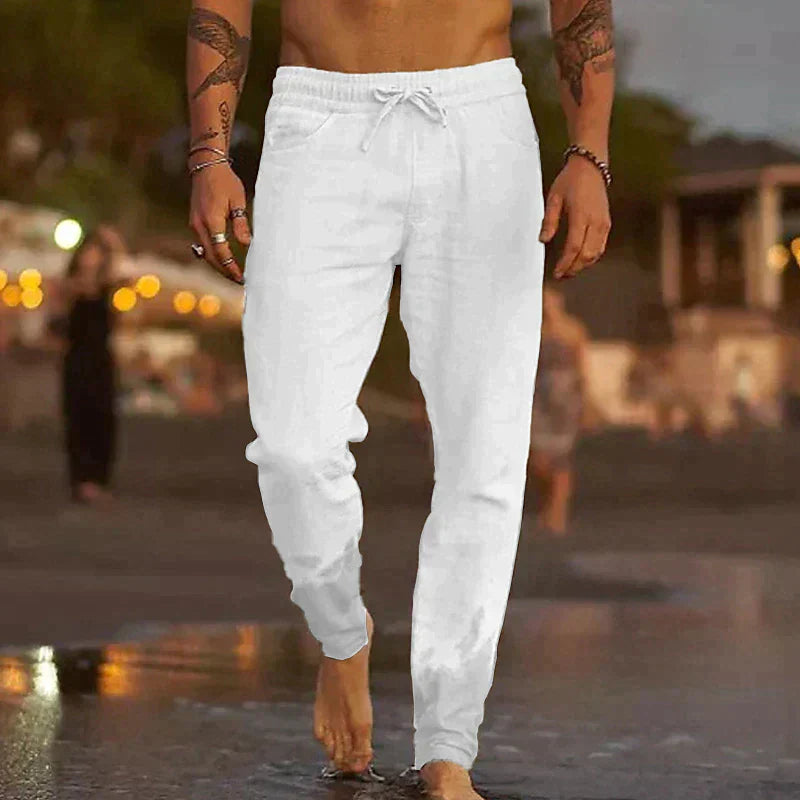 "Pantalon en lin léger pour homme, coupe ample, taille élastique, poches plaquées, couleurs variées, style décontracté."