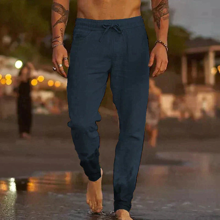 "Pantalon en lin léger pour homme, coupe ample, taille élastique, poches plaquées, couleurs variées, style décontracté."