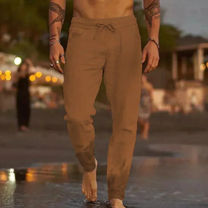 "Pantalon en lin léger pour hommes, coupe décontractée, disponible en beige, blanc, bleu, gris et noir, parfait pour l'été."